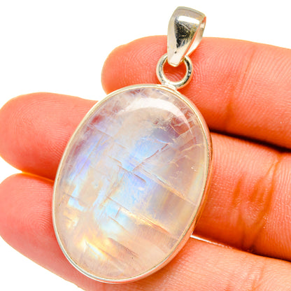Oval rainbow moonstone pendant with sterling silver bail, close-up