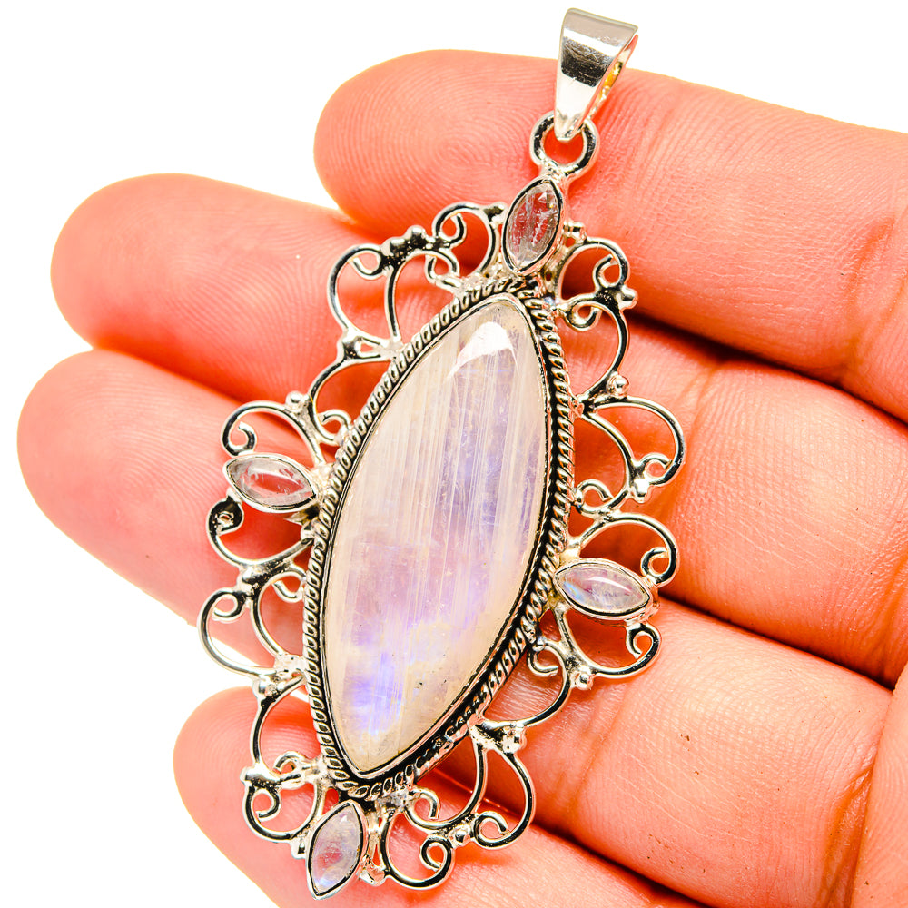 Sterling silver teardrop moonstone pendant with ornate filigree and hanging bail