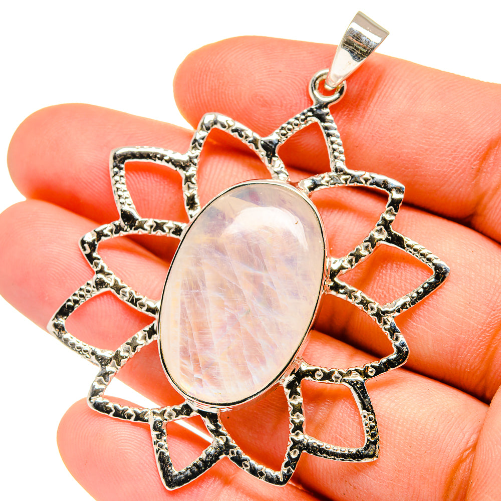 Sterling silver moonstone pendant with oval opalescent stone in open starburst setting