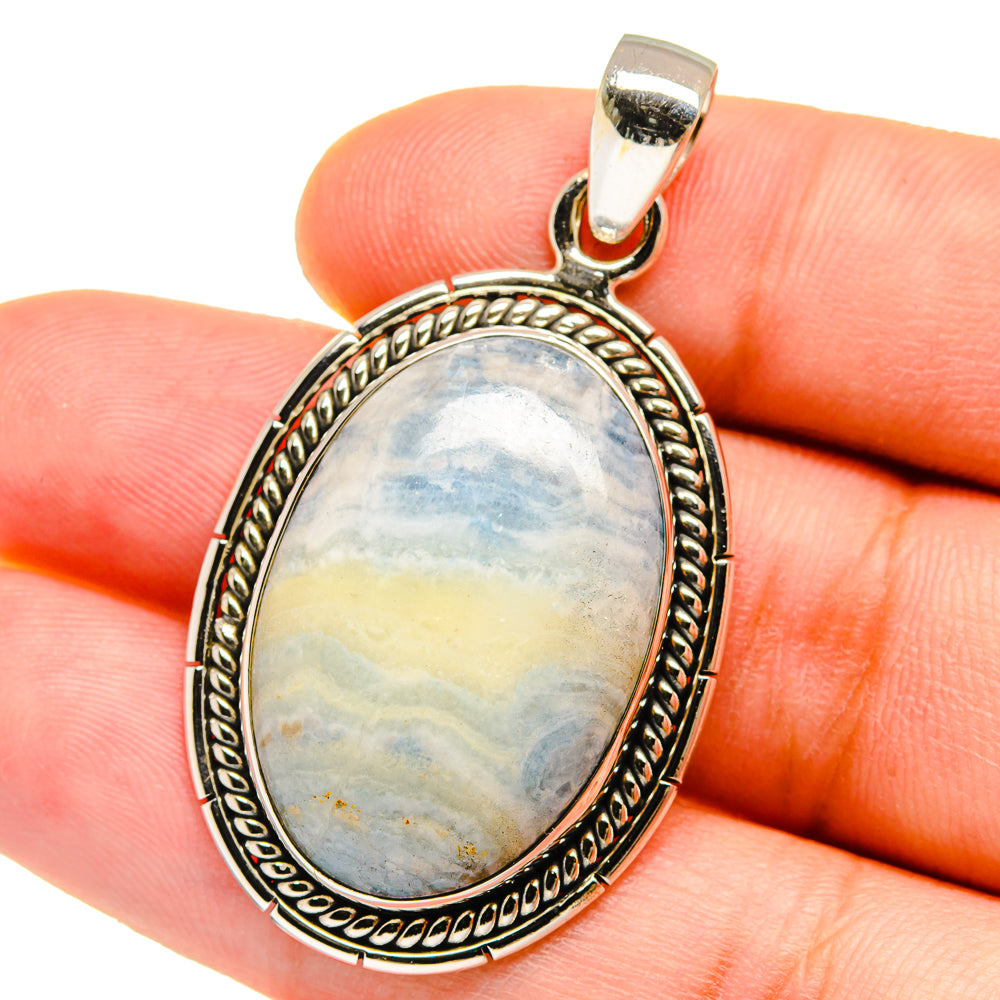 Blue scheelite pendant in oval sterling silver bezel, close-up on bail