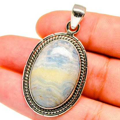 Blue scheelite pendant in oval sterling silver bezel, close-up on bail