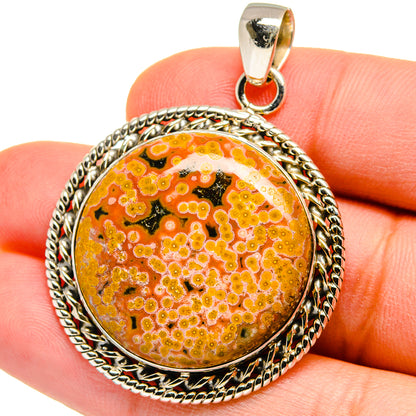 Round ocean jasper cabochon pendant in 925 sterling silver bezel with rope border
