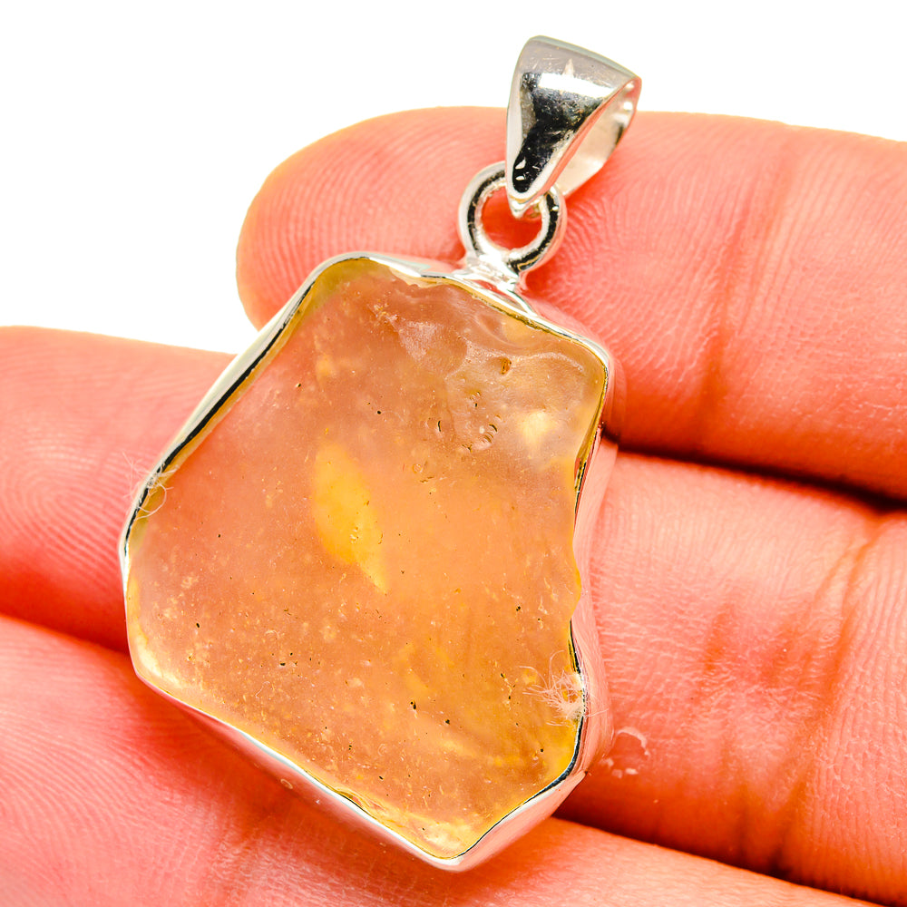 Amber glass pendant with 925 sterling silver bail and bezel, irregular cut