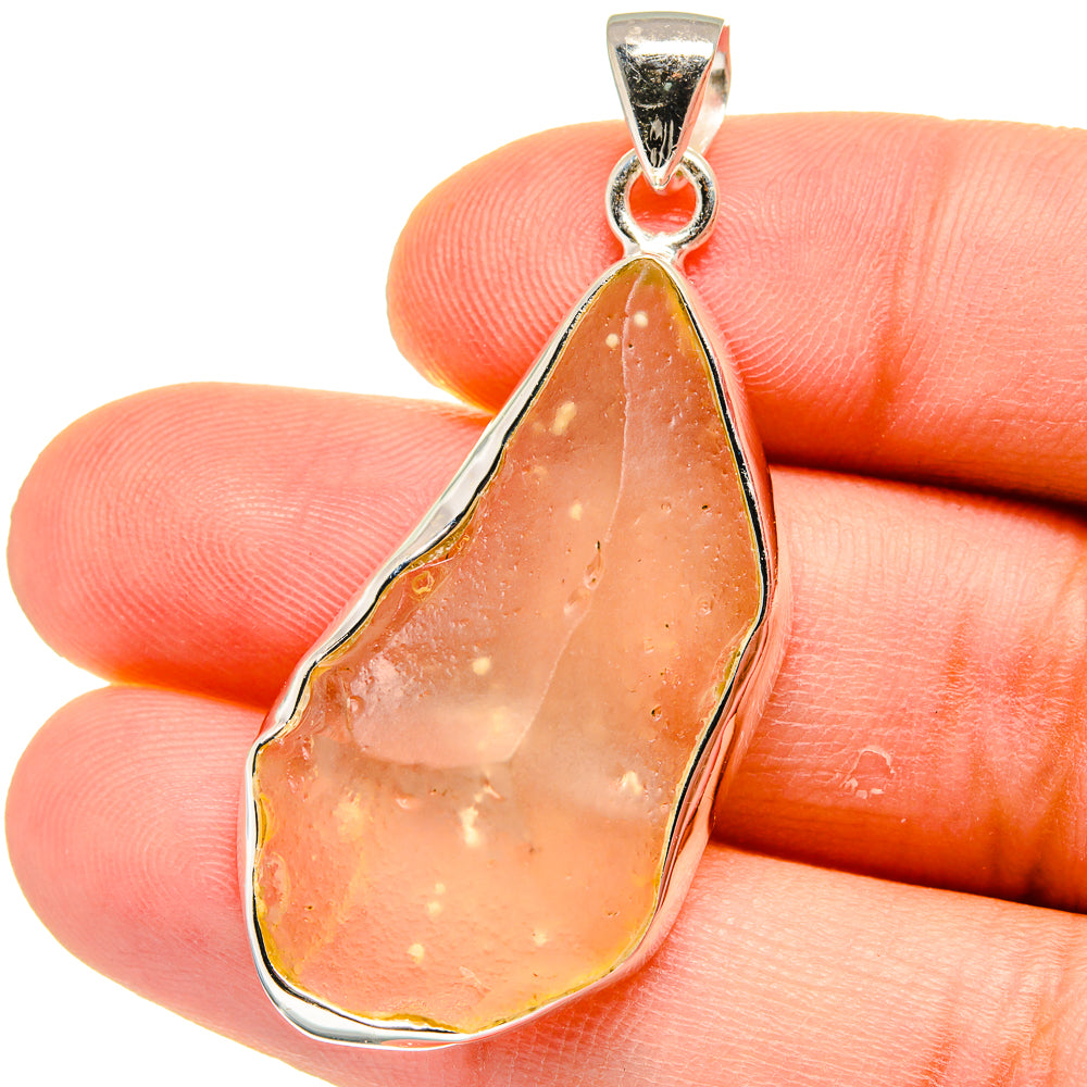 Sterling silver teardrop pendant with orange-brown Libyan Desert Glass cabochon