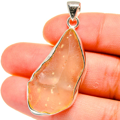 Sterling silver teardrop pendant with orange-brown Libyan Desert Glass cabochon