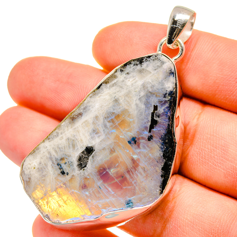 Teardrop moonstone pendant with 925 silver bail, shown on hand for size, rainbow shine
