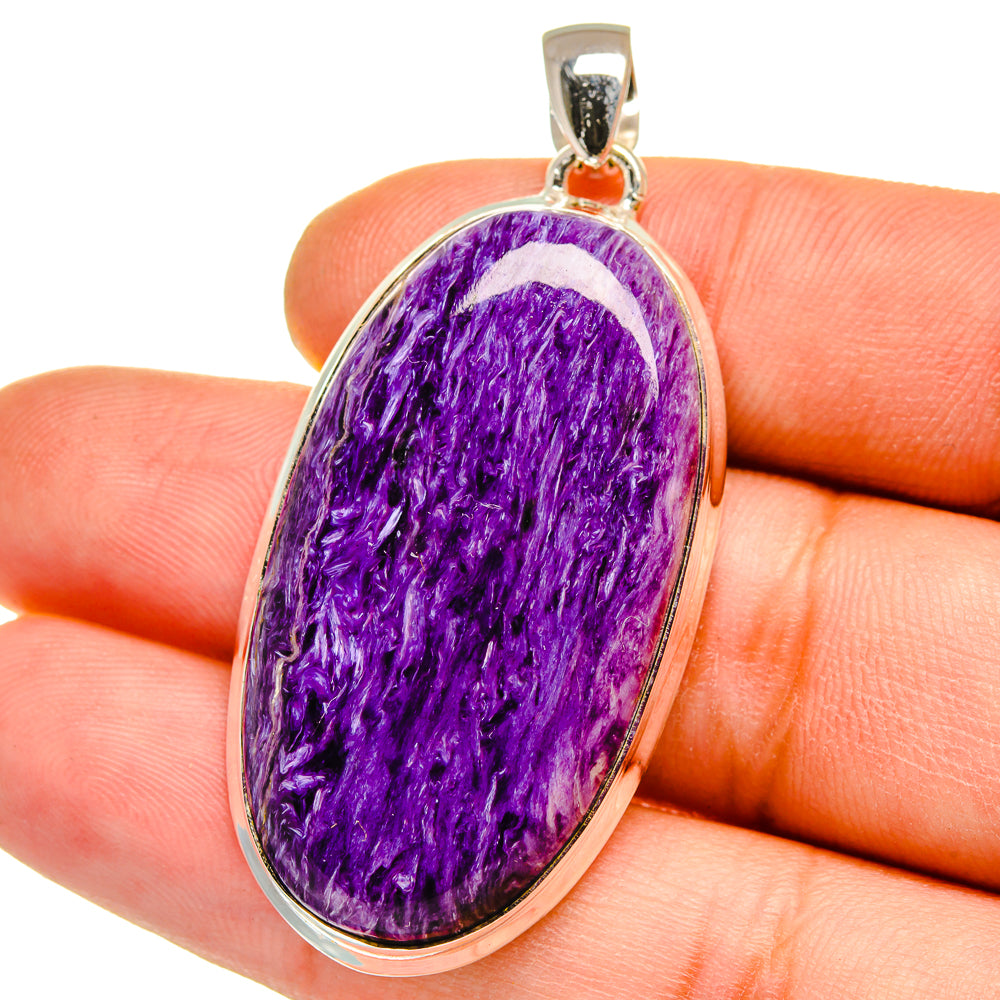 Sterling silver oval charoite pendant with glossy purple cabochon and bail loop