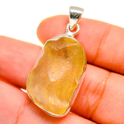 Amber Libyan Desert Glass pendant with sterling silver bail, heart-shaped stone