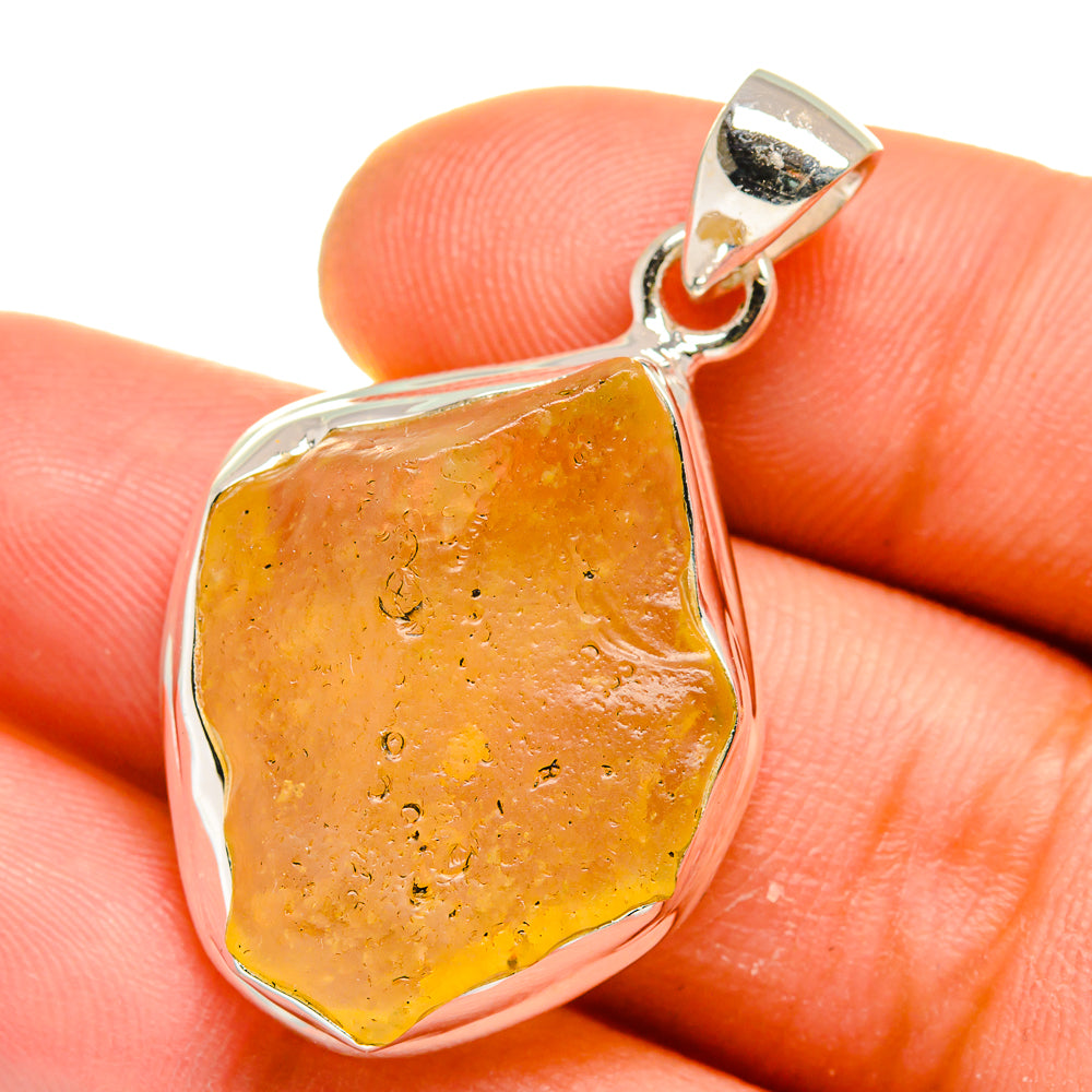 Sterling silver pendant with faceted orange-yellow Libyan desert glass, top bail