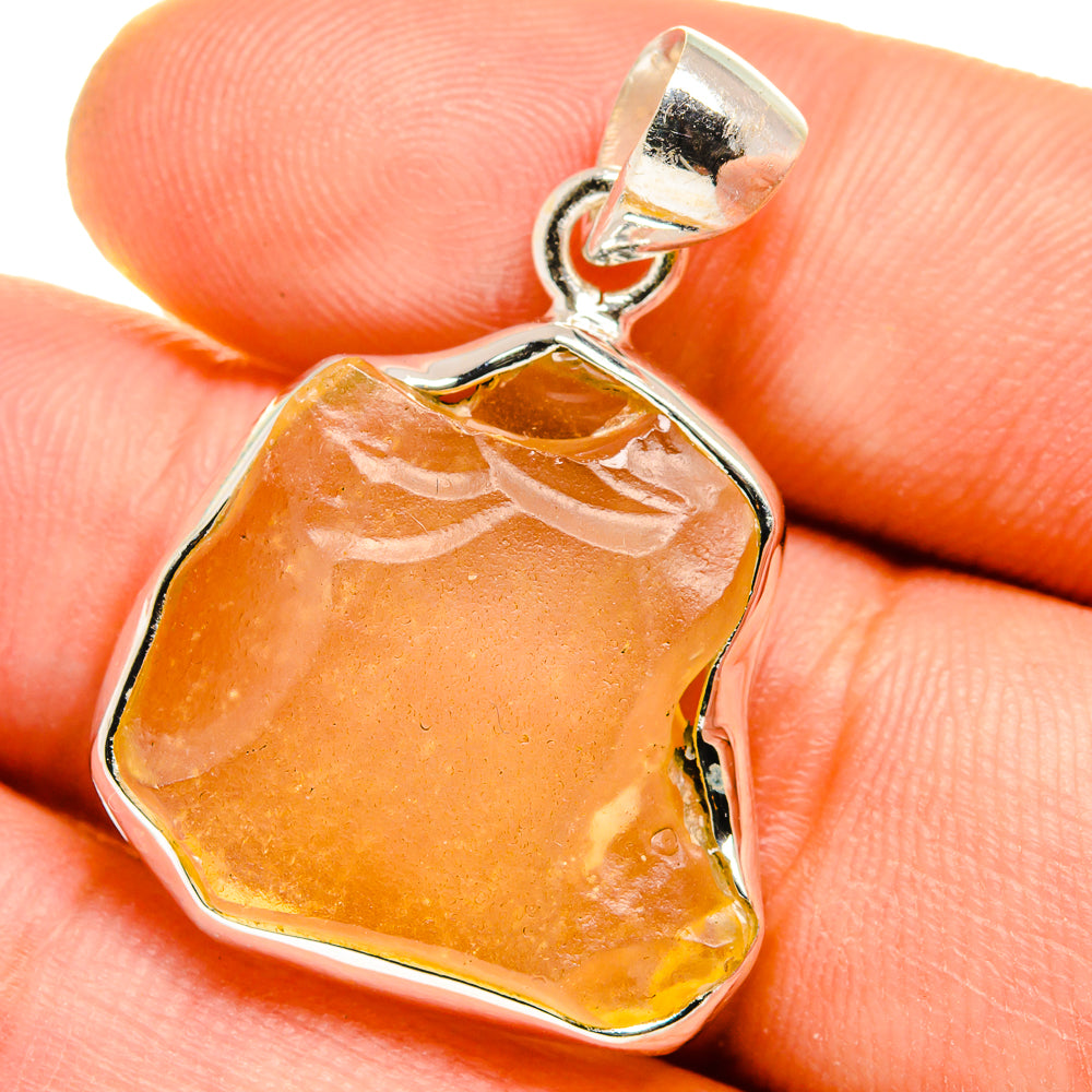 925 sterling silver pendant with amber desert glass, faceted rough stone in bezel