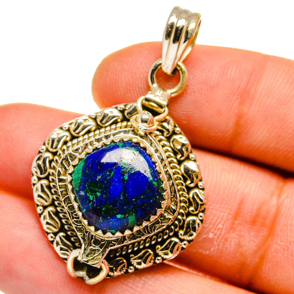 925 sterling silver pendant with oval blue gemstone and filigree frame