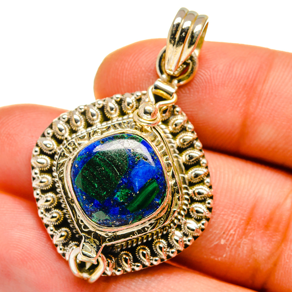 Antique-style teardrop pendant with blue-green gemstone cabochon in silver-tone frame