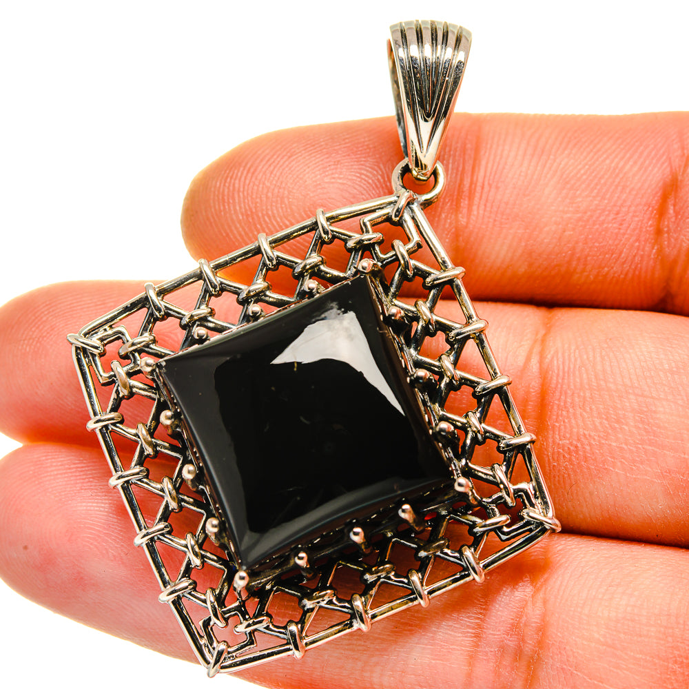 Square black onyx pendant in openwork sterling silver frame with top bail