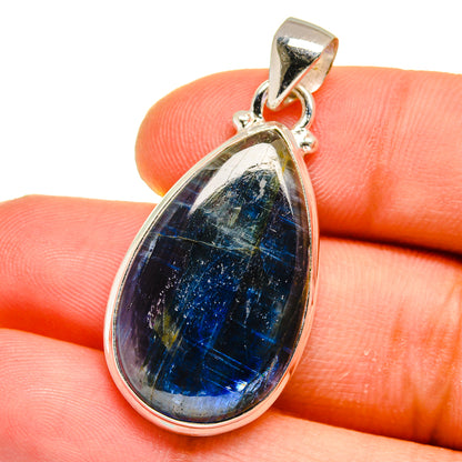 Kyanite teardrop pendant in 925 sterling silver bezel, close-up on gemstone