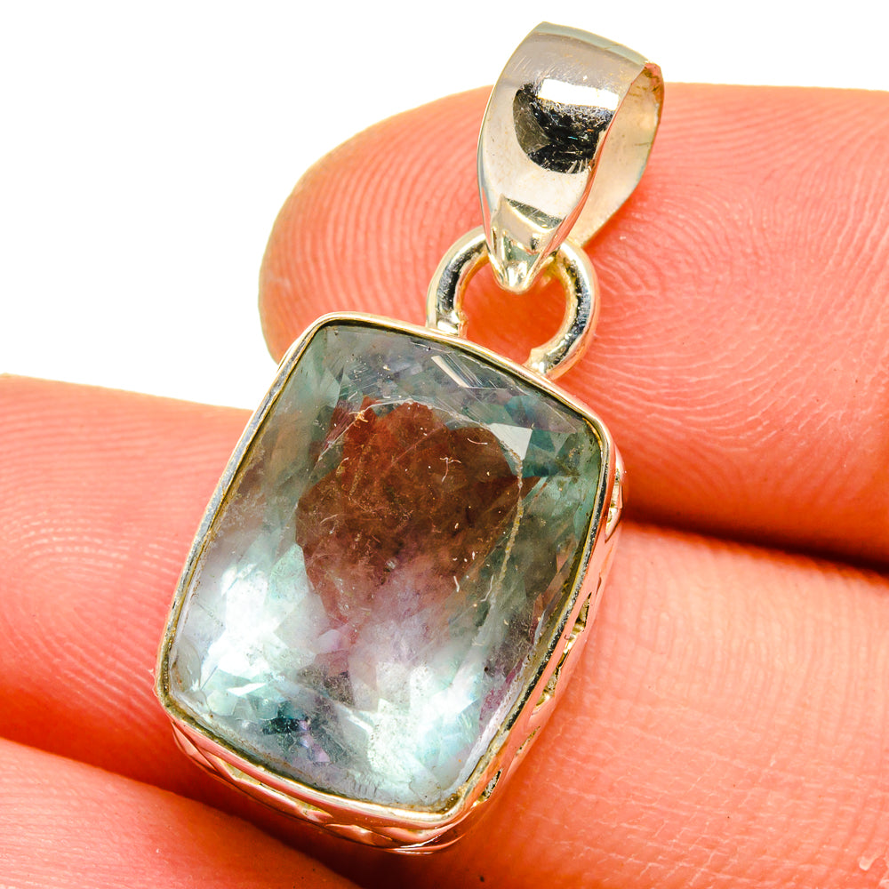 Square bezel pendant with faceted blue-green stone in sterling silver bail
