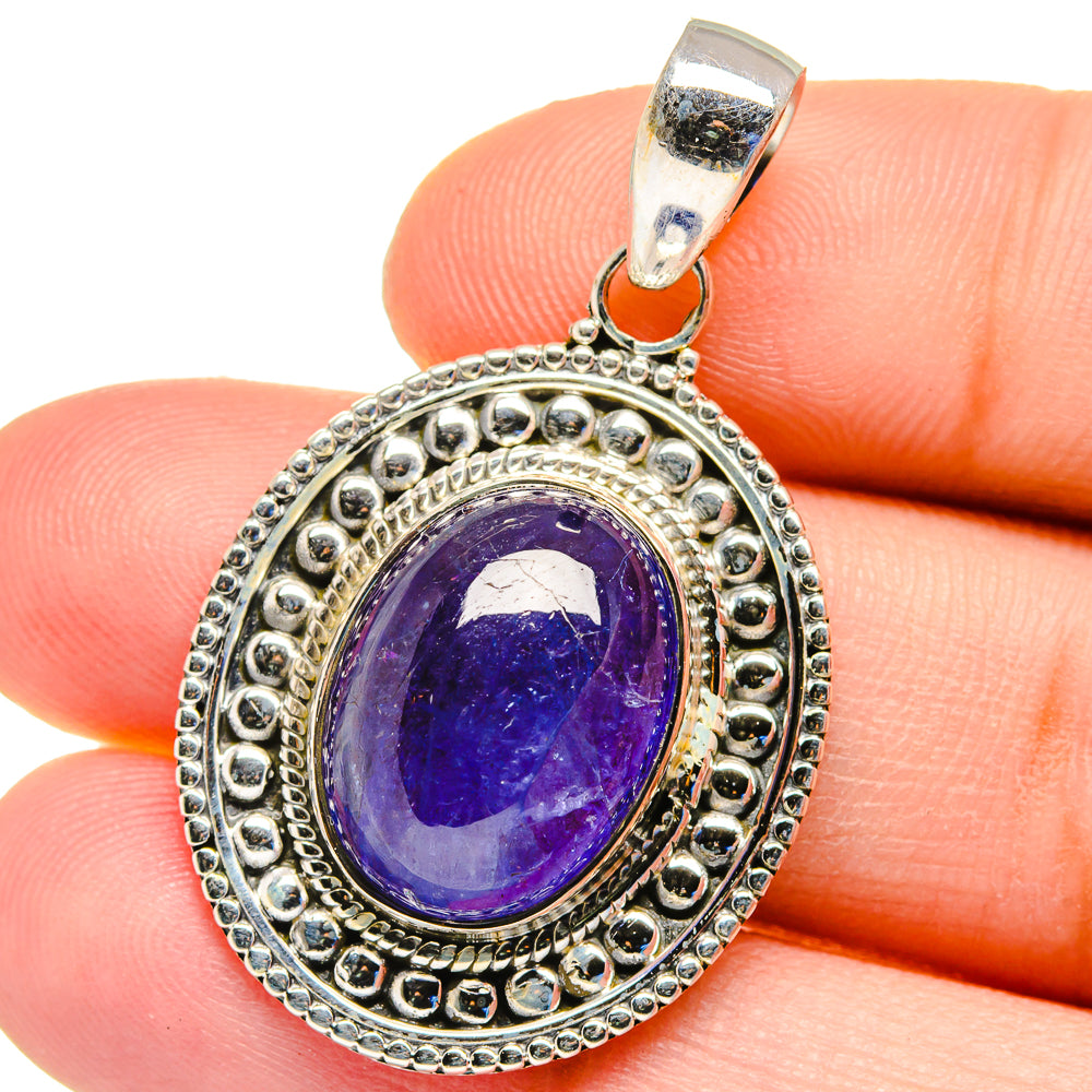 Oval tanzanite pendant close-up with purple stone and beadwork 925 sterling silver bail.