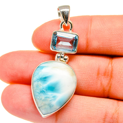 Sterling silver pendant close-up: square blue topaz and teardrop Larimar