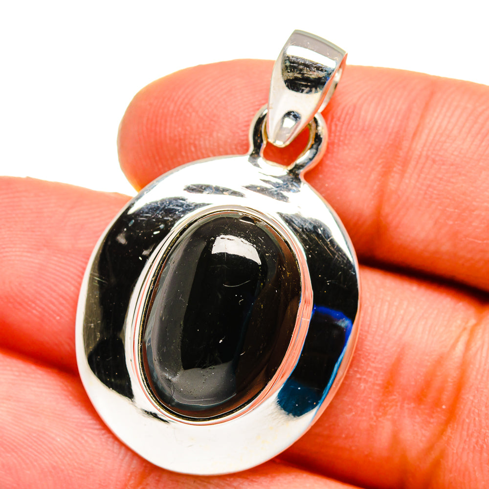 Sterling silver pendant with oval black onyx cabochon and top bail