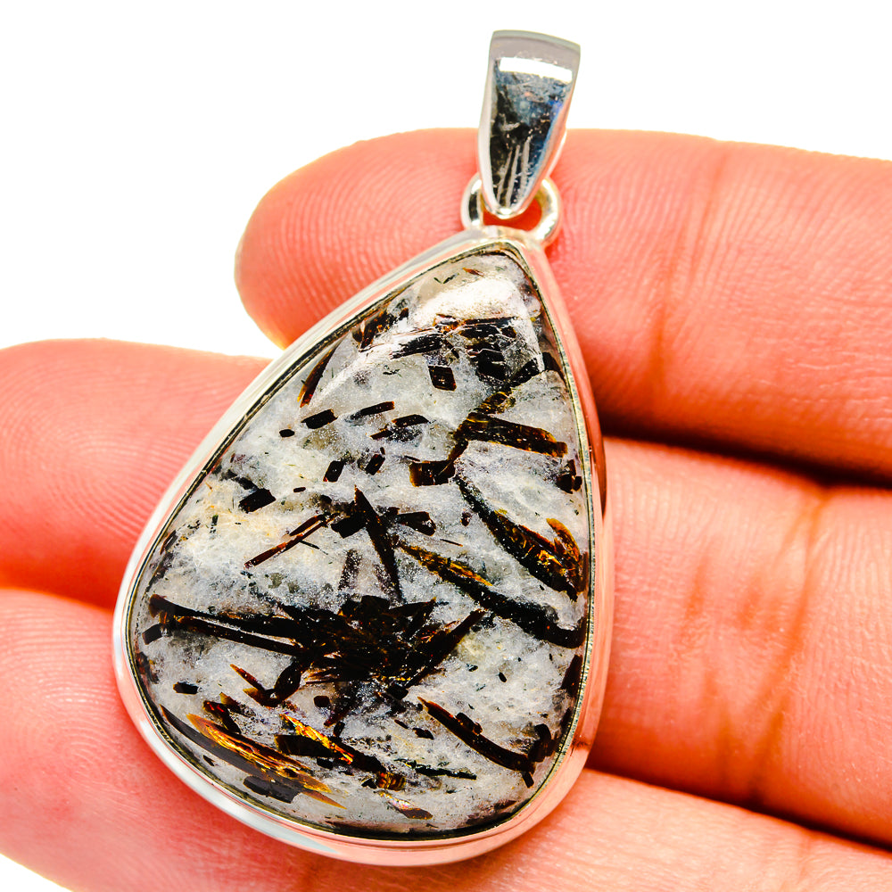 Sterling silver bail teardrop pendant with white stone, black shards, and warm gold lines