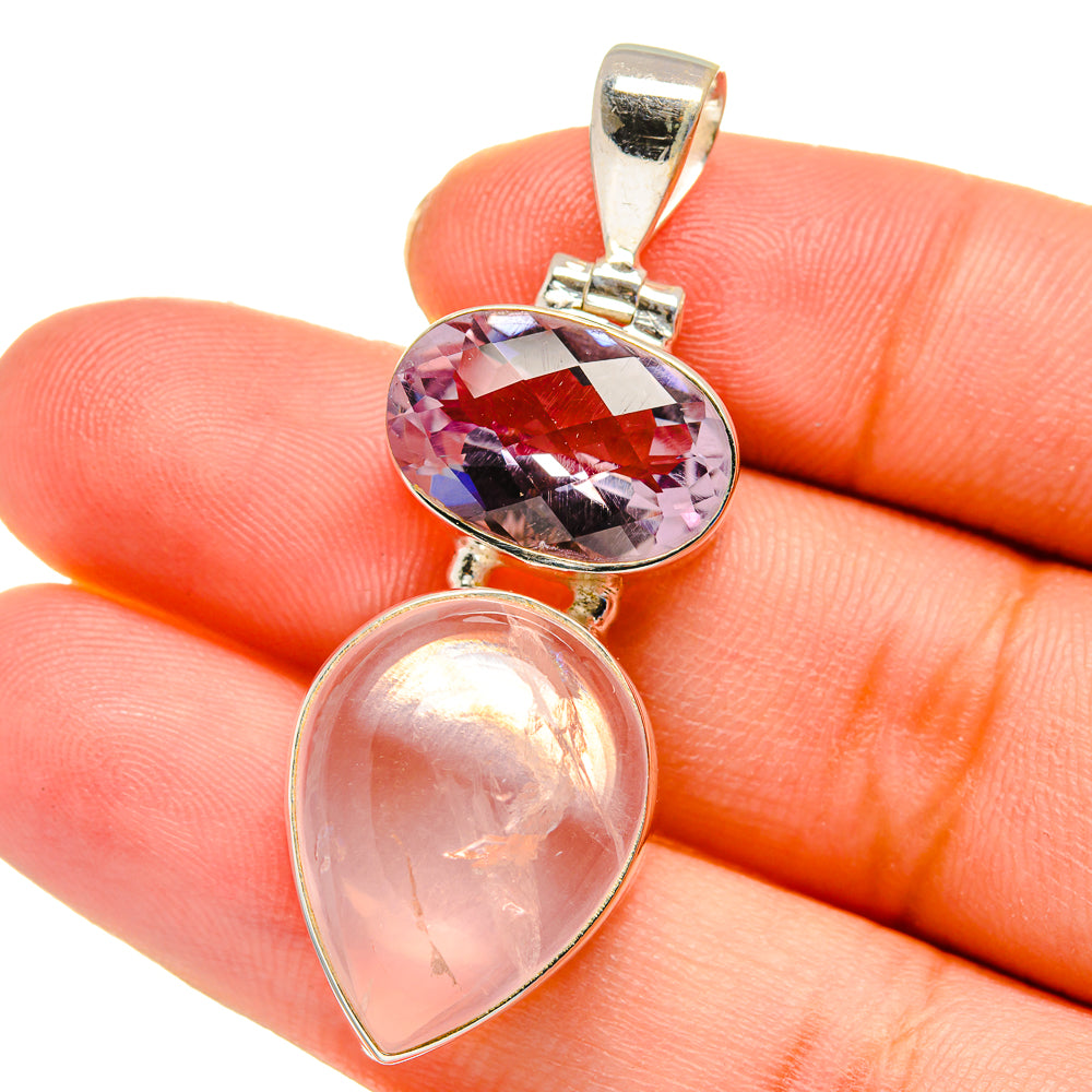 Close-up sterling silver gemstone pendant with pink oval top and teardrop bottom
