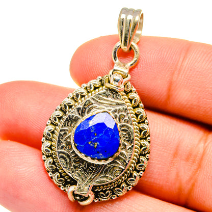 Lapis lazuli teardrop pendant in 925 sterling silver with ornate gold-tone bezel