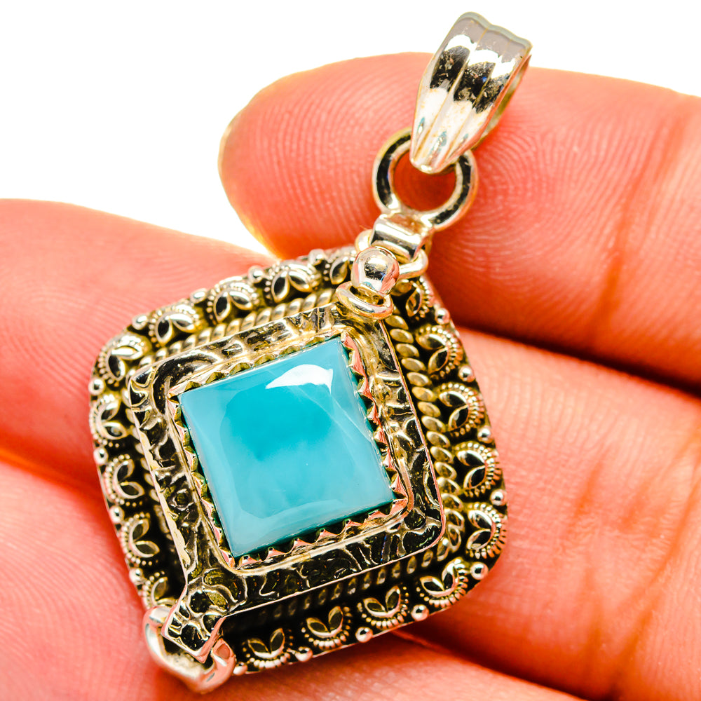 Sterling silver larimar pendant with square blue gemstone and ornate filigree frame