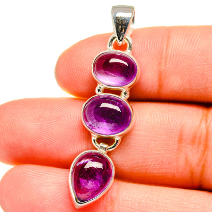 Sterling silver amethyst pendant with three oval purple gemstones, bail at top