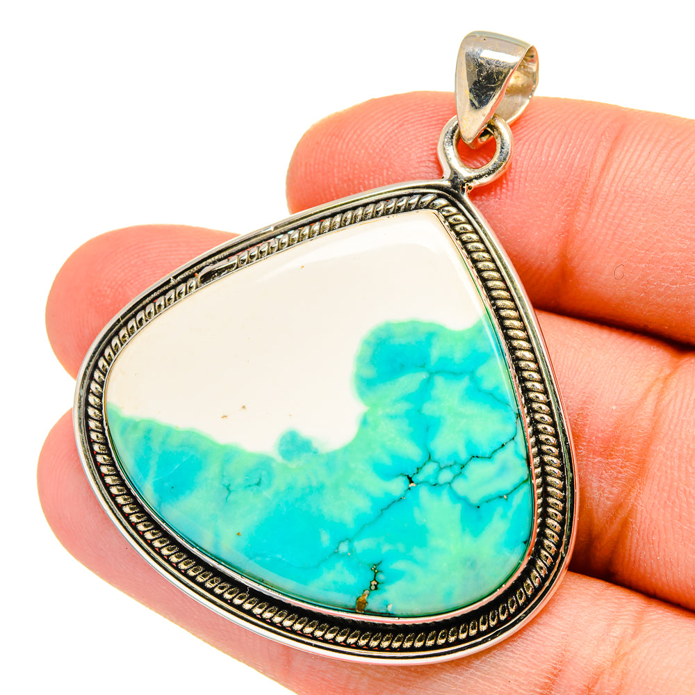 Turquoise howlite teardrop pendant in 925 sterling silver bezel setting