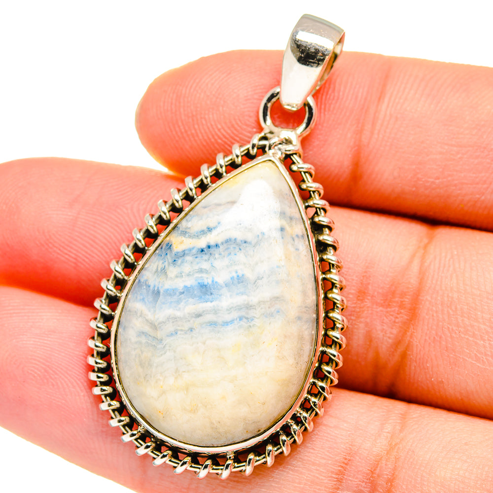 Teardrop scheelite gemstone pendant with blue-white stone in 925 sterling silver frame