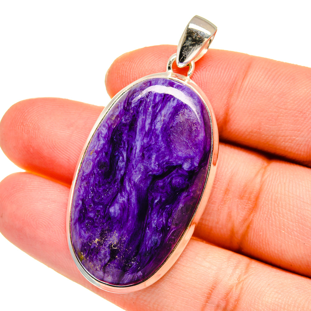 Purple charoite cabochon pendant in polished 925 sterling silver bezel, close-up