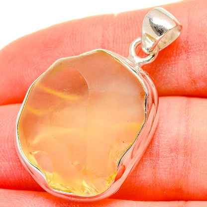Sterling silver pendant with faceted yellow-orange Libyan Desert Glass stone
