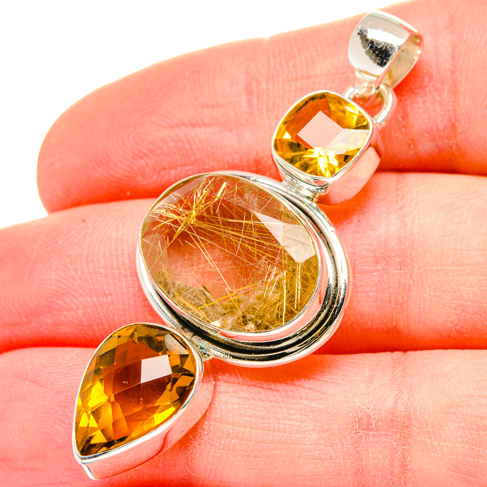 Sterling silver pendant with oval rutilated quartz and two citrine teardrop stones