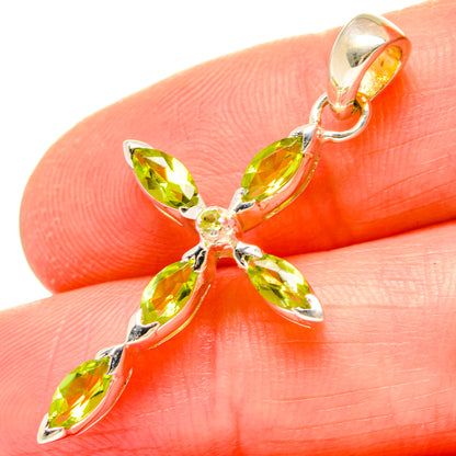 Cross pendant with five marquise peridot-green stones and metal bail loop