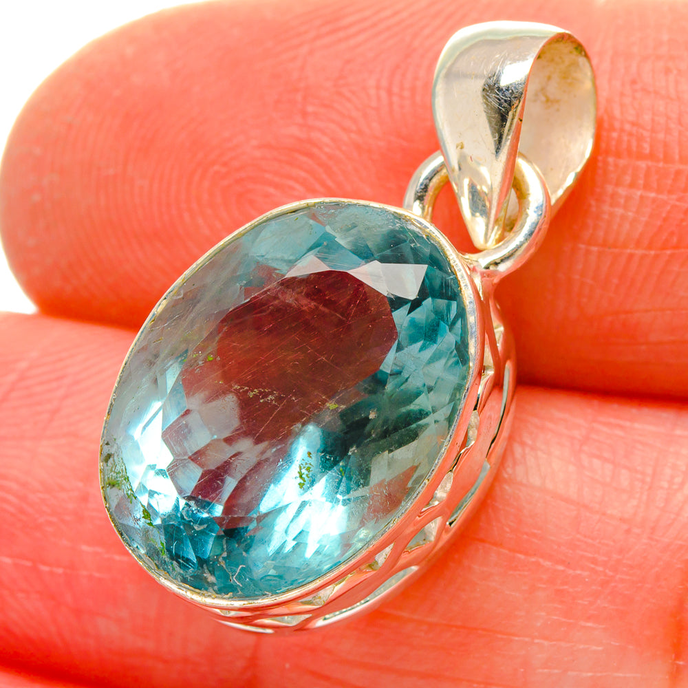 Oval blue-green fluorite pendant with faceted stone in sterling silver setting