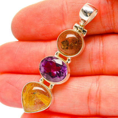 Heart-shaped gemstone pendant with purple amethyst and amber rutilated quartz, oval bezels