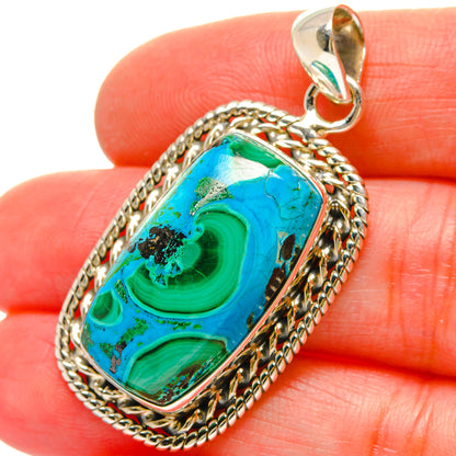 Sterling silver pendant with blue-green oval stone, rope bezel, and bail loop