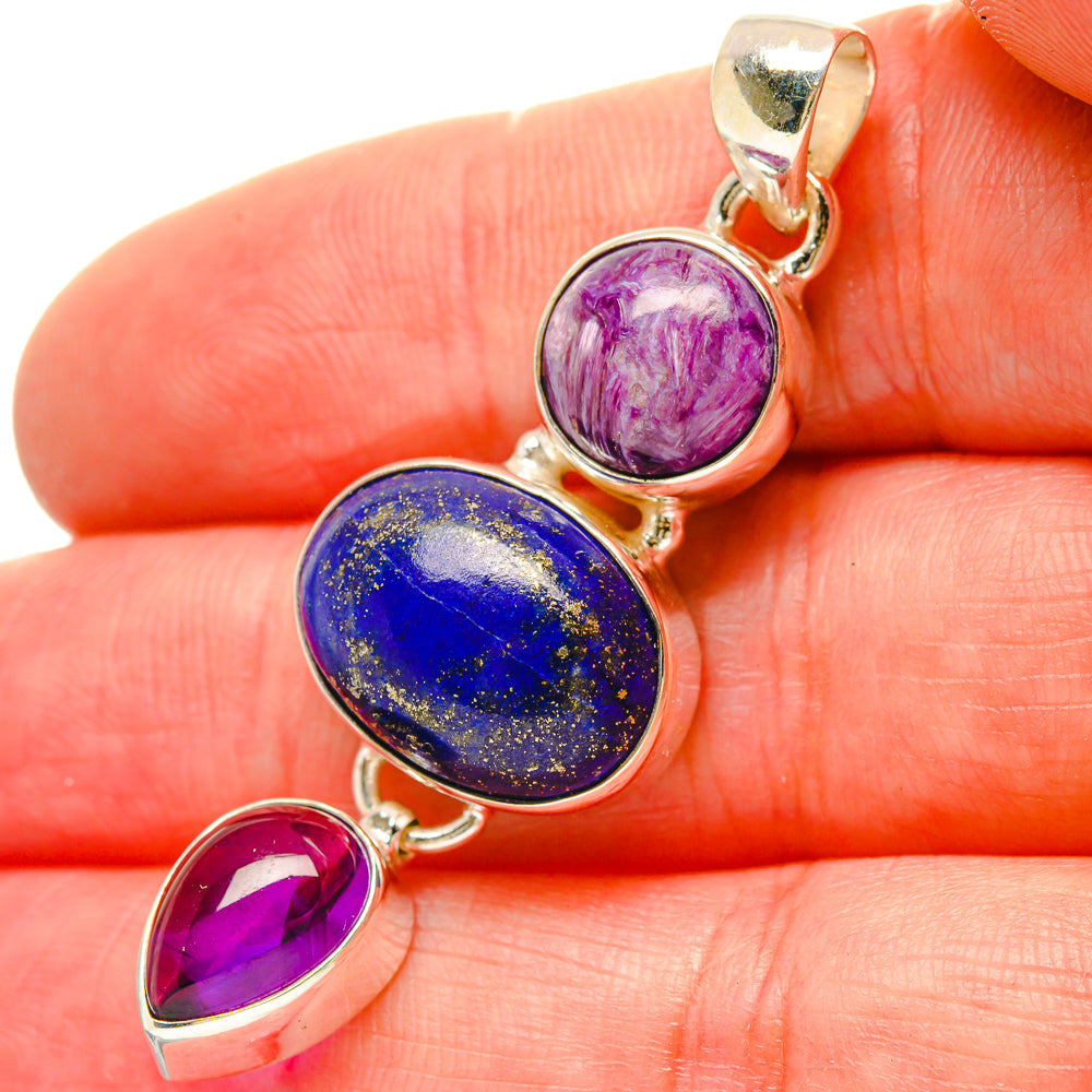 Oval gemstone pendant in 925 sterling silver with blue lapis and two purple cabochons