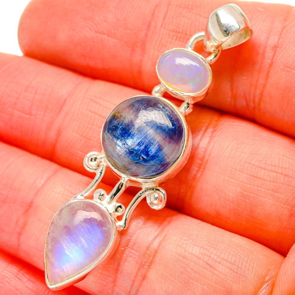 Sterling silver moonstone pendant with blue center oval and purple opalescent teardrops