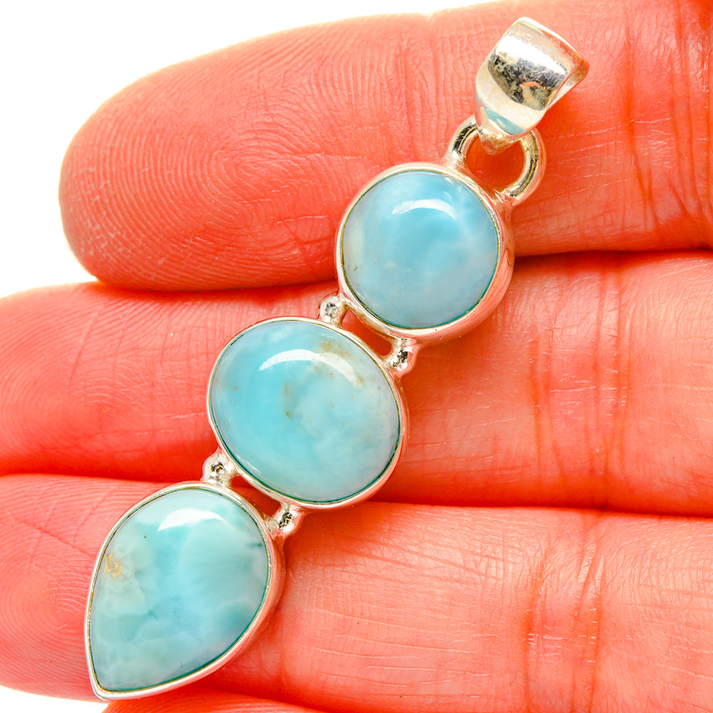 Larimar and sterling silver pendant with three oval blue stones, gold-toned bezels