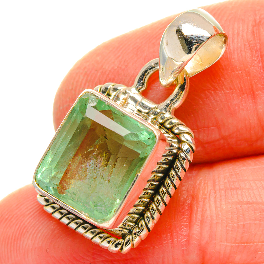 Green fluorite pendant with rectangular stone and ornate silver bail, angled view