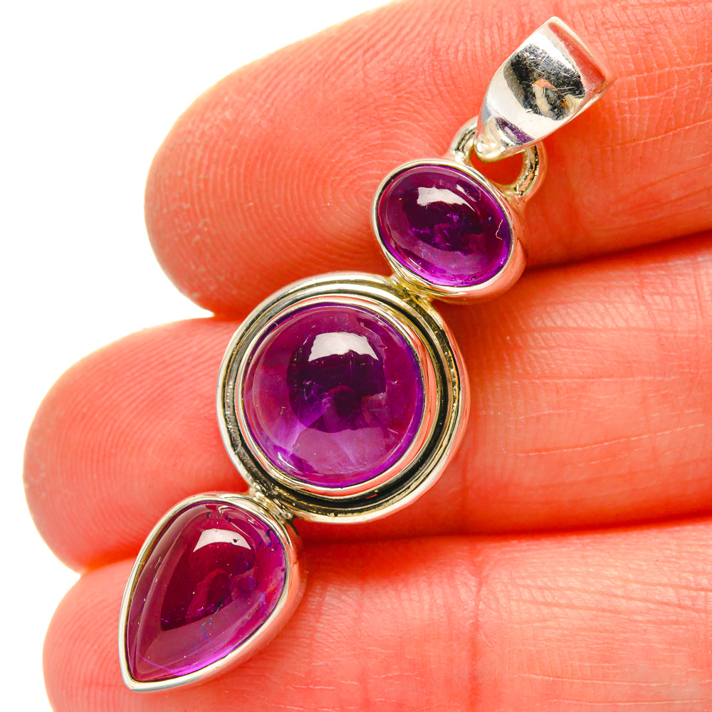 925 sterling silver amethyst pendant with three purple stones: round, round, teardrop bezel