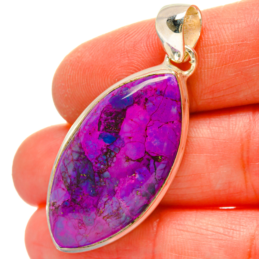 Purple oval turquoise pendant close-up with gold-toned bail and silver bezel