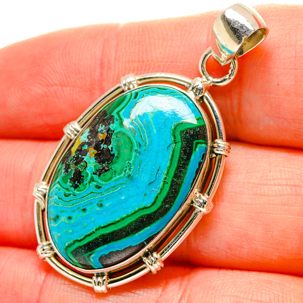 Oval blue-green gemstone pendant in sterling silver bezel with bail loop
