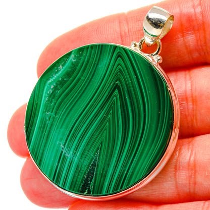 Malachite oval pendant in green with 925 sterling silver bail and bezel.