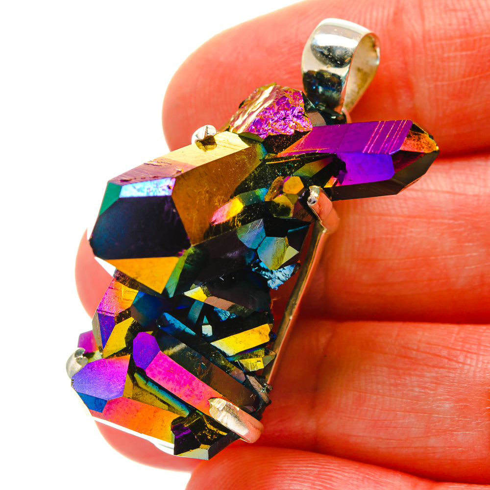 Close-up of rainbow iridescent druzy pendant with silver bezel and top bail loop.