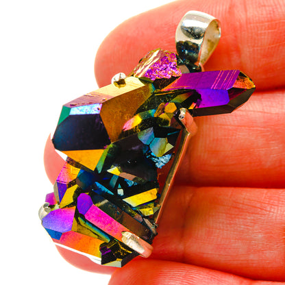Close-up of rainbow iridescent druzy pendant with silver bezel and top bail loop.
