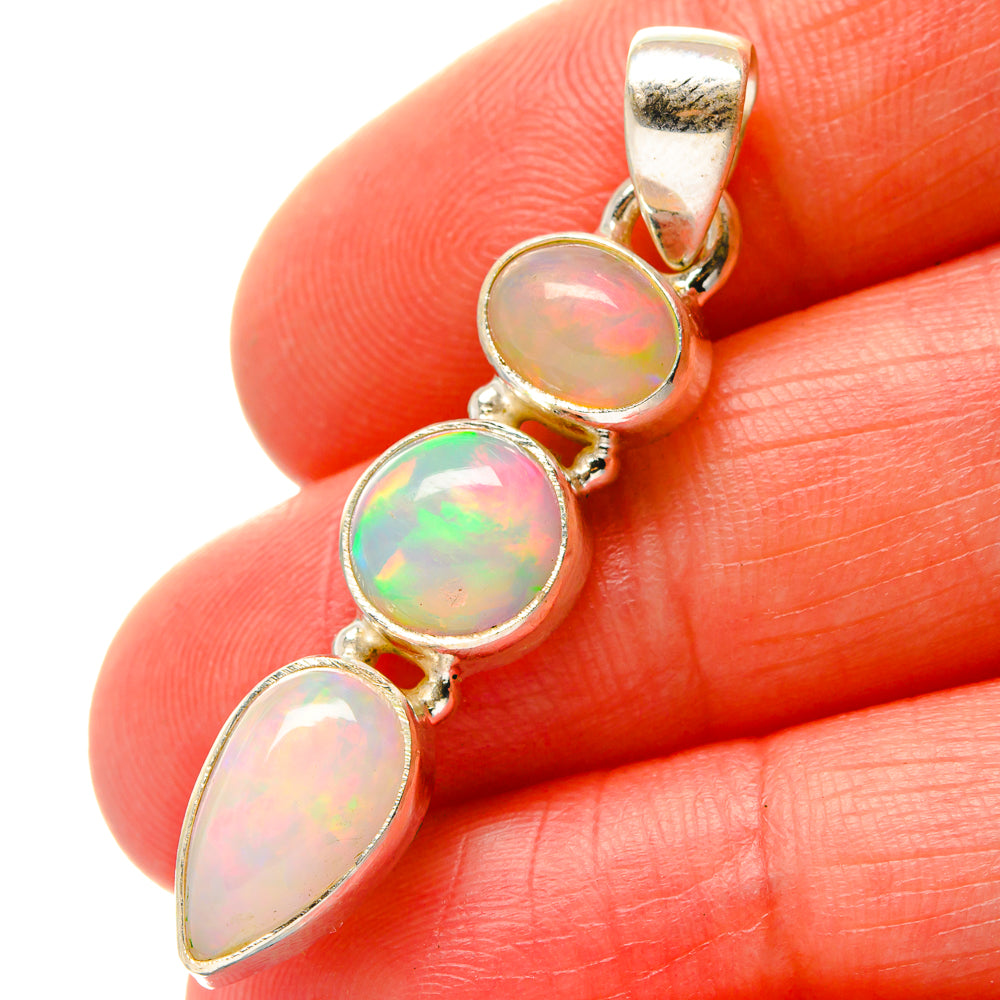 Sterling silver opal pendant with three oval cabochons and top loop bail