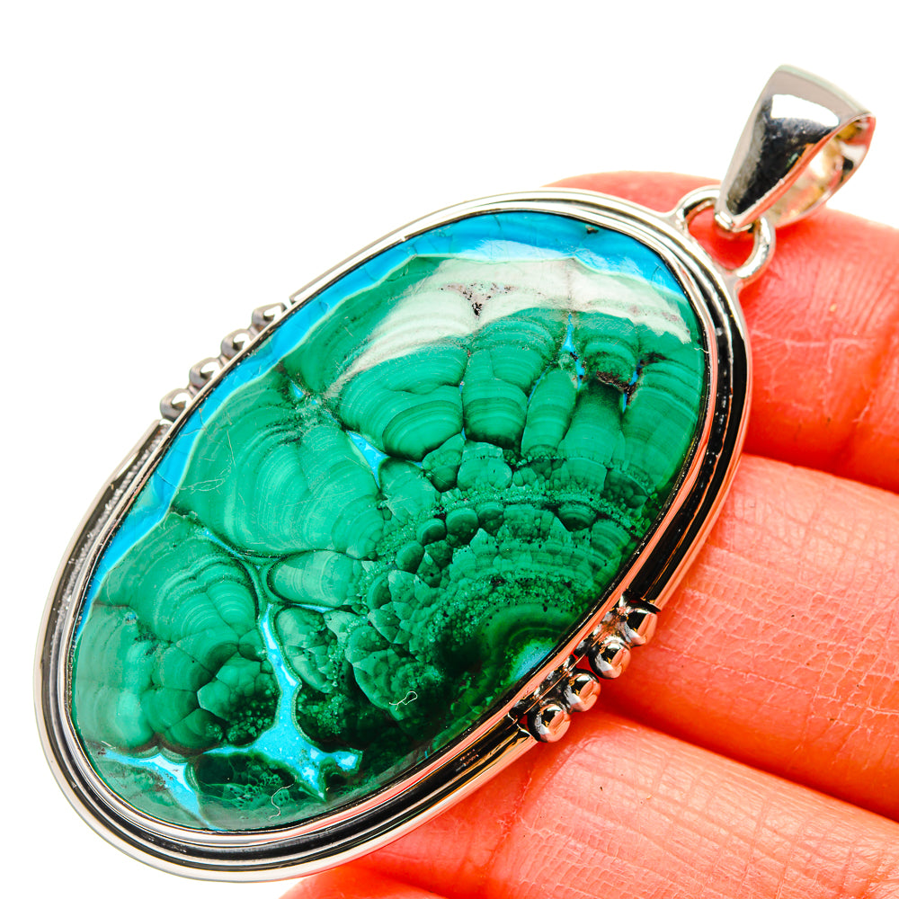 Oval 925 sterling silver pendant with green striped cabochon stone and loop bail