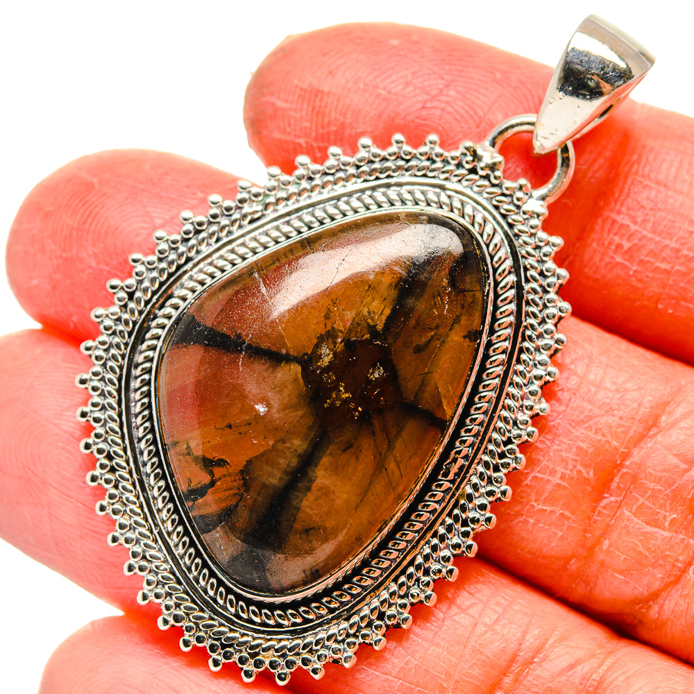 925 sterling silver oval chiastolite pendant with decorative halo border and bail