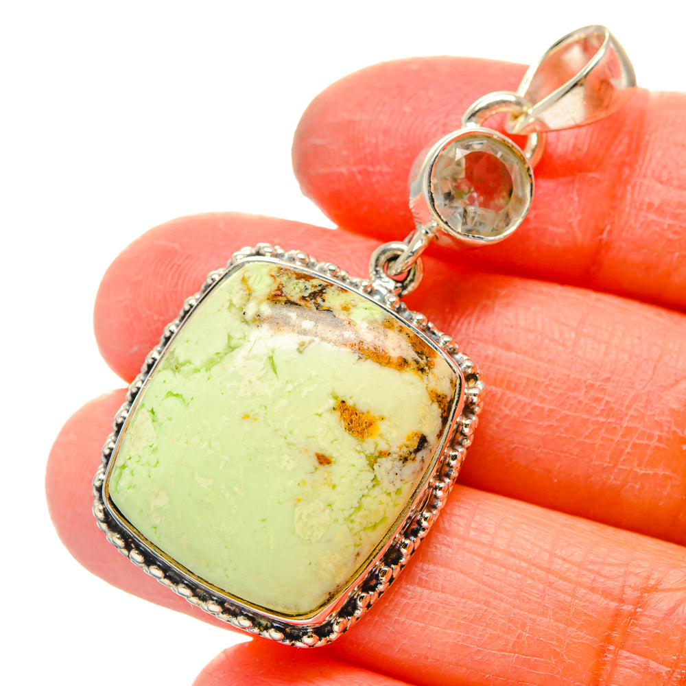 Sterling silver pendant with lemon-green rectangular gemstone and round top crystal charm